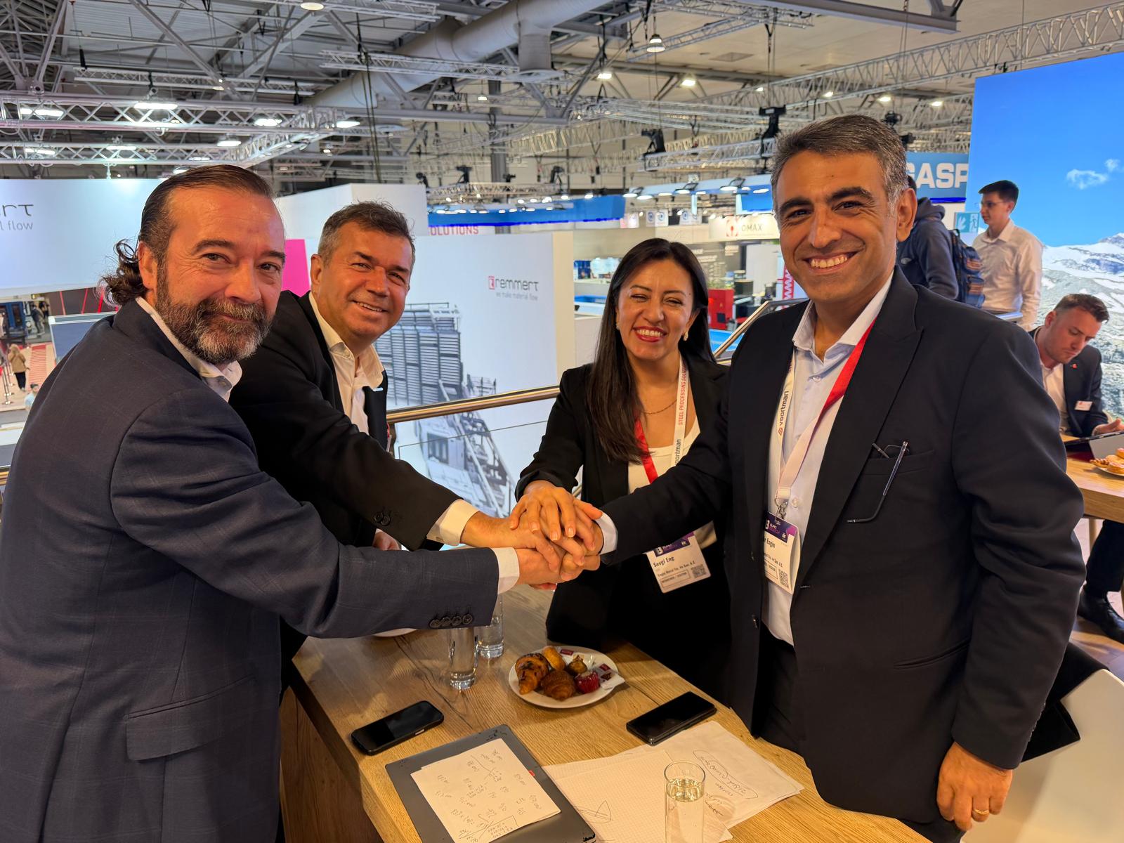 Engin Metal and Bystronic executives after signing the agreement at EuroBLECH 2026